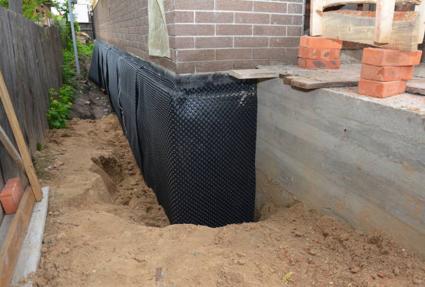 SJ Waterproofing Pros technician performing targeted Emergency Waterproofing assessment in Warsaw, IL